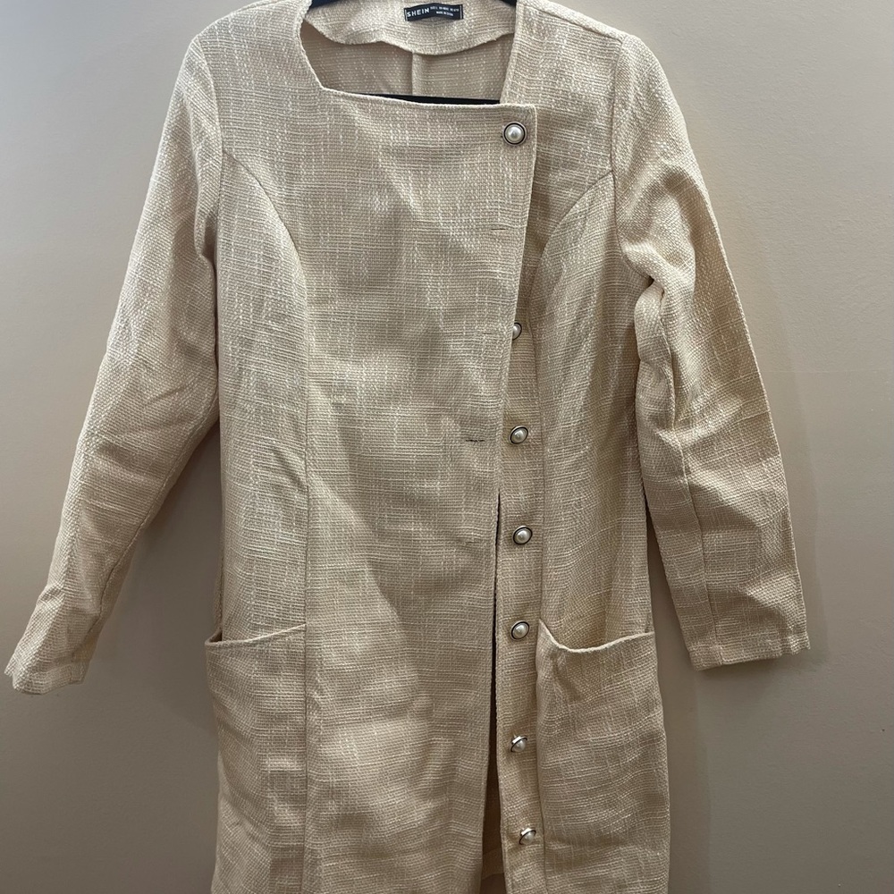 Cream jacket with pearl buttons